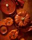 A white cast iron pumpkin dutch oven on a table. preview