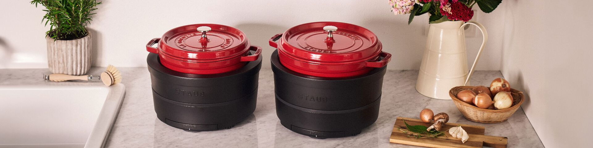 Two STAUB high-quality Dutch oven cocottes nesting in the new Induction cooker